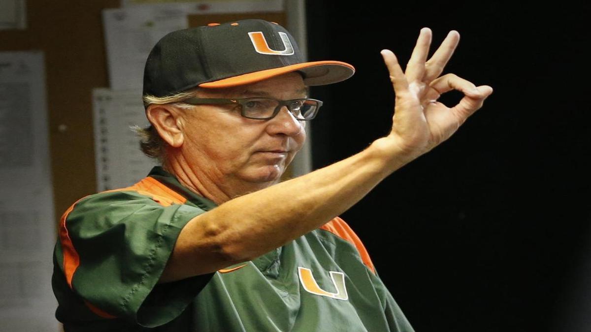 
University of Miami head coach Jim Morris signals as the Hurricanes host Florida International University in the NCAA baseball tournament’s Coral Gables Regional at Alex Rodriguez Park at Mark Light Field in Coral Gables on May 29, 2015

