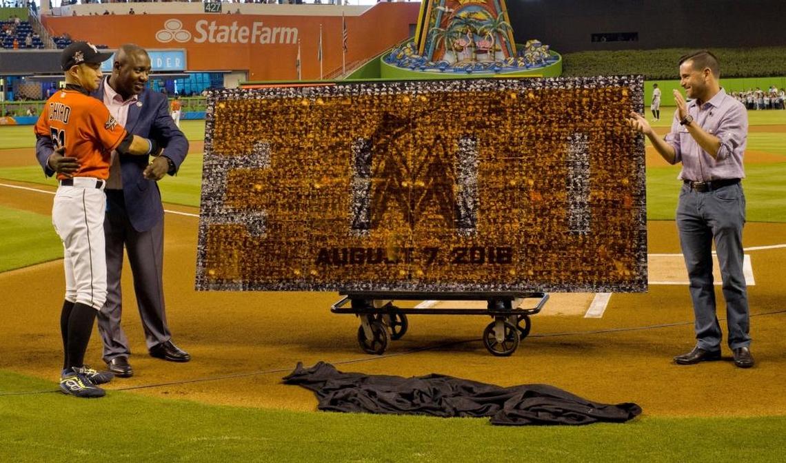 The Marlins' Ichiro Suzuki receives a commemorative gift for his 3000th hit from Michael Hill, President of Baseball Operations and David Samson , President of the Miami Marlins at a ceremony prior to the Miami Marlins hosting the Pittsburgh Pirates on Sun., April 27, 2017.