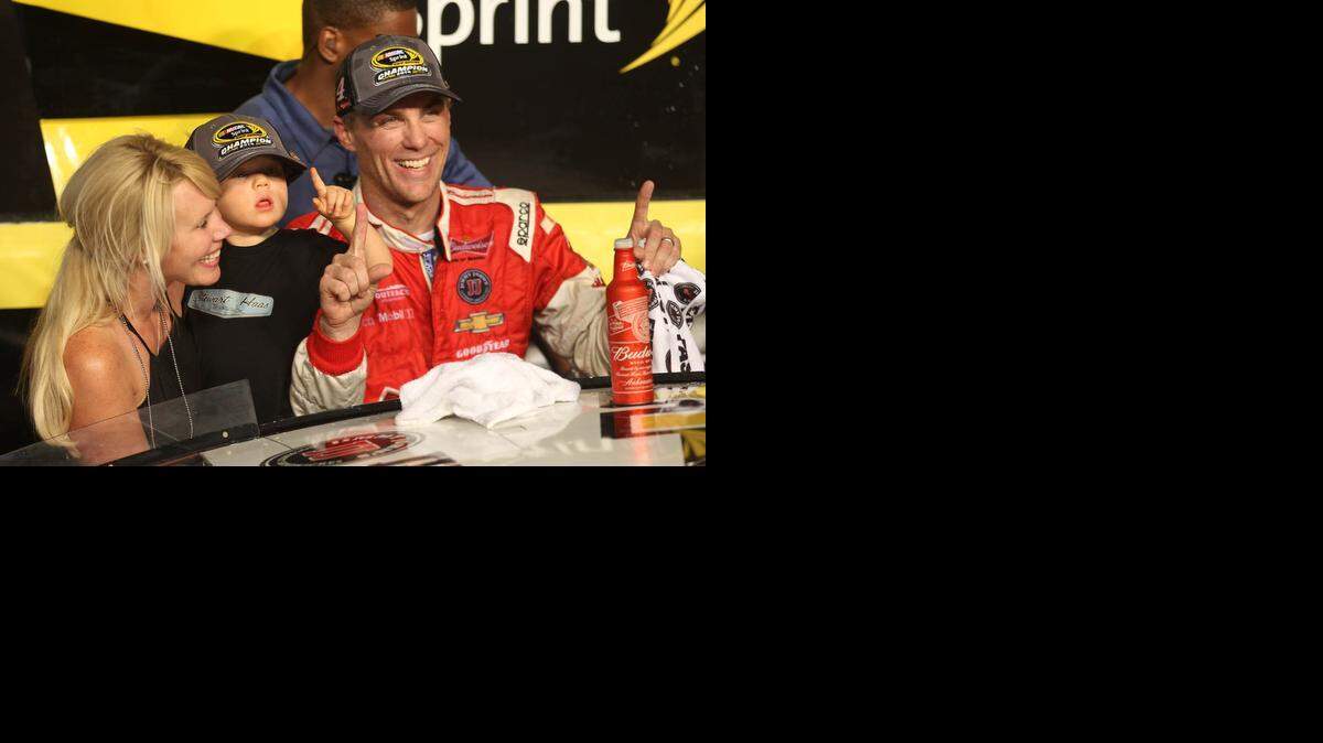 Family time:  Kevin Harvick, his wife, DeLana, and son Keelan Paul Harvick celebrate winning the NASCAR 2014 Sprint Cup championship and the  Ford EcoBoost 400 on Sunday at Homestead-Miami Speedway.