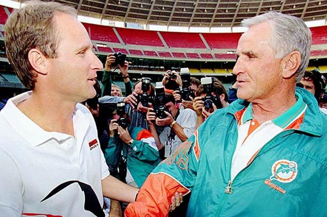 Don and Dave Shula meet before a Dolphins-Bengals game in 1994 in the first-ever father vs. son meeting of NFL head coaches. Don is 88 today and Dave, at 58, has returned to coaching for the first time in 21 years.