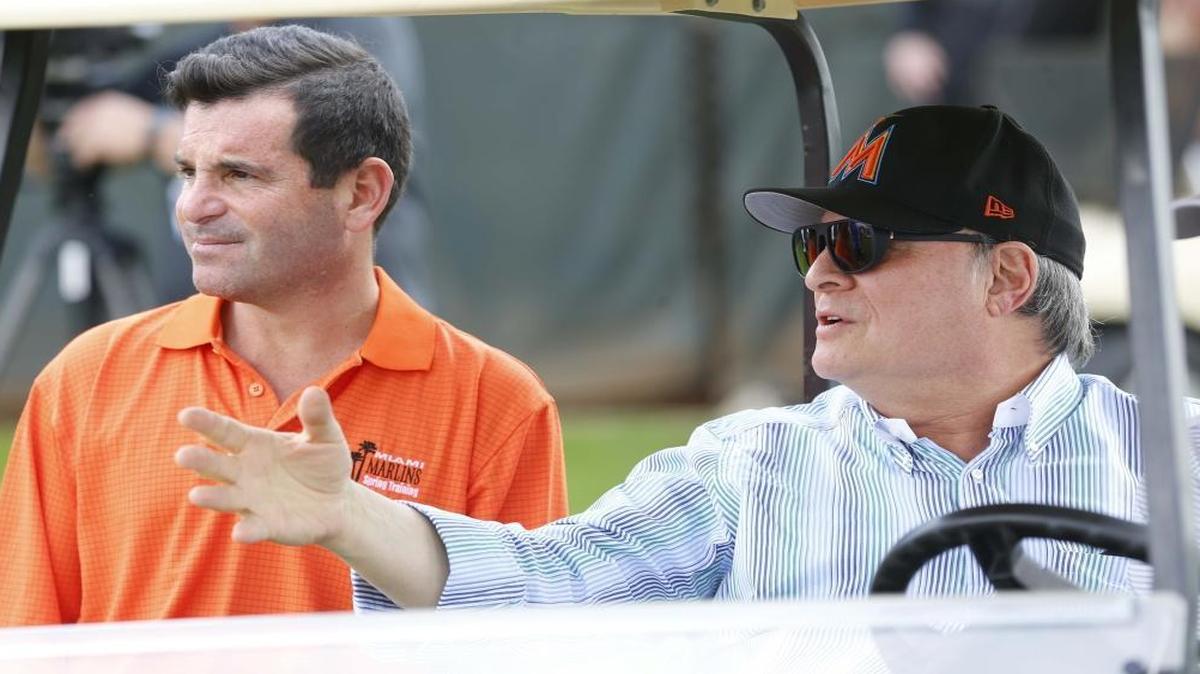 David Samson, President of the Miami Marlins, speaks to owner Jeffrey Loria during the first day of the team's spring training in Jupiter on Tues., Feb. 14, 2017.