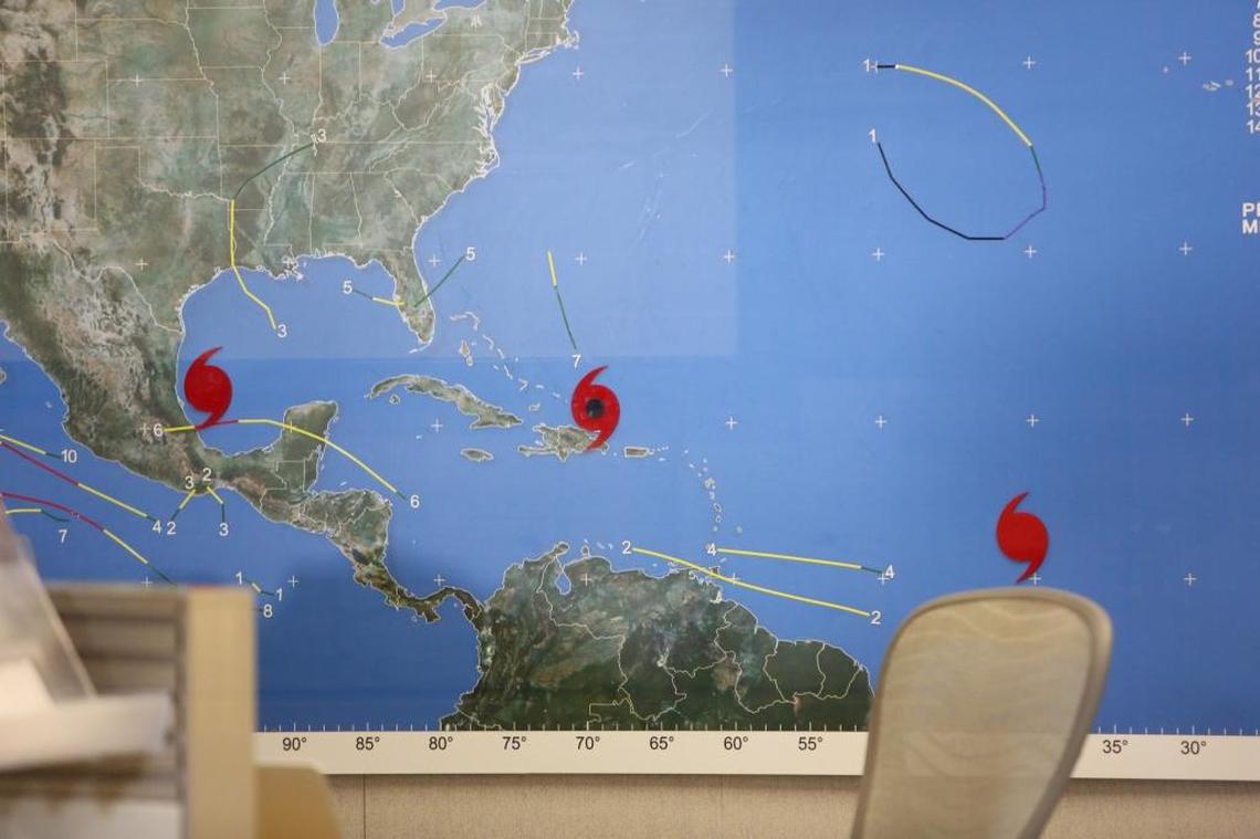 A map on the wall at the National Hurricane Center on Thursday afternoon, Sept. 7 2017, shows three current hurricanes on the map, Katia, Irma and Jose.