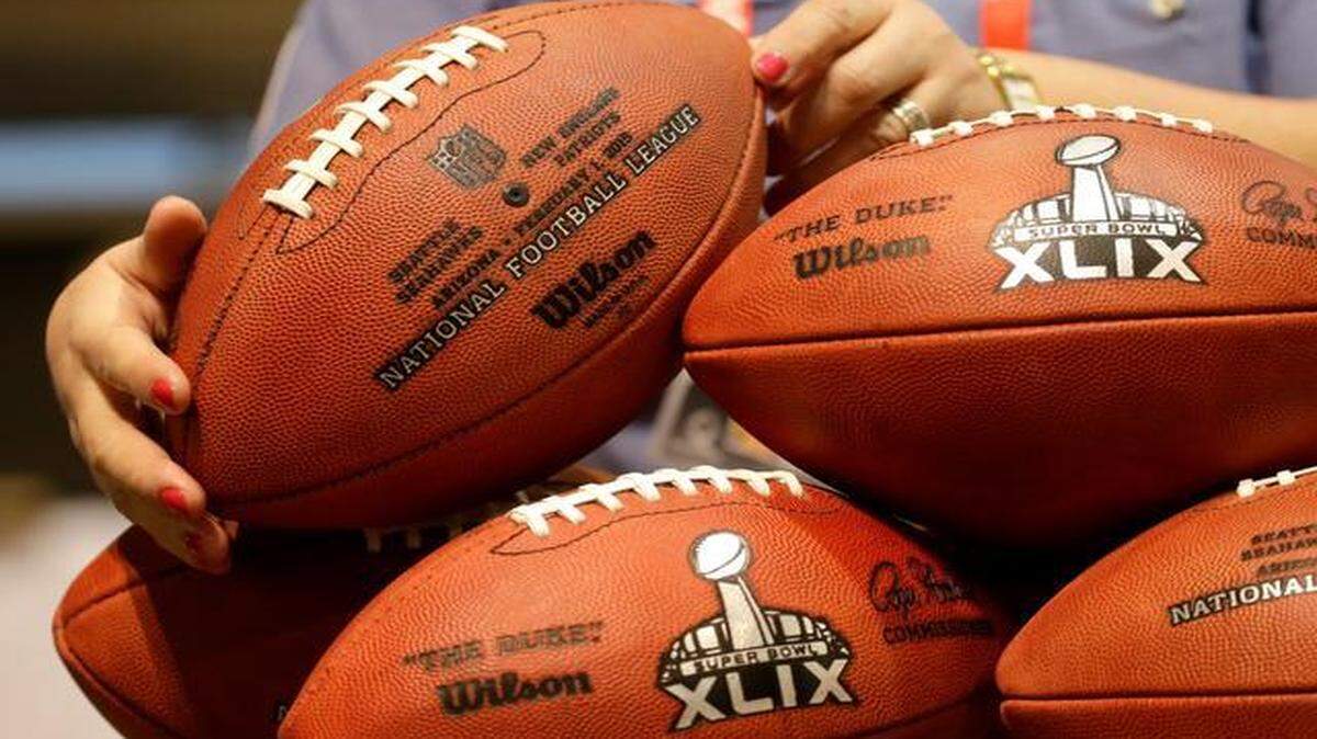 

Souvenirs: Wilson Sporting Goods provides replica Super Bowl 49 footballs at the NFL Experience.

