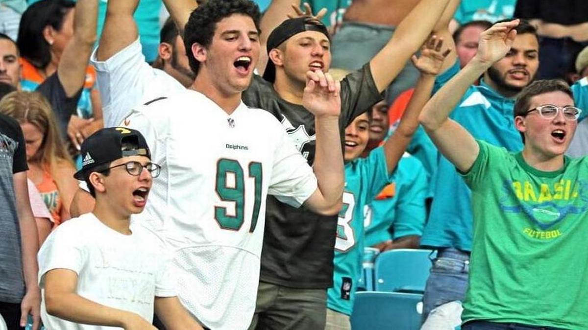 Dolphins fans cheer as the Miami Dolphins play the Atlanta Falcons in the first preseason game at the Hard Rock Stadium in Miami Gardens, Florida, Aug. 10, 2017.