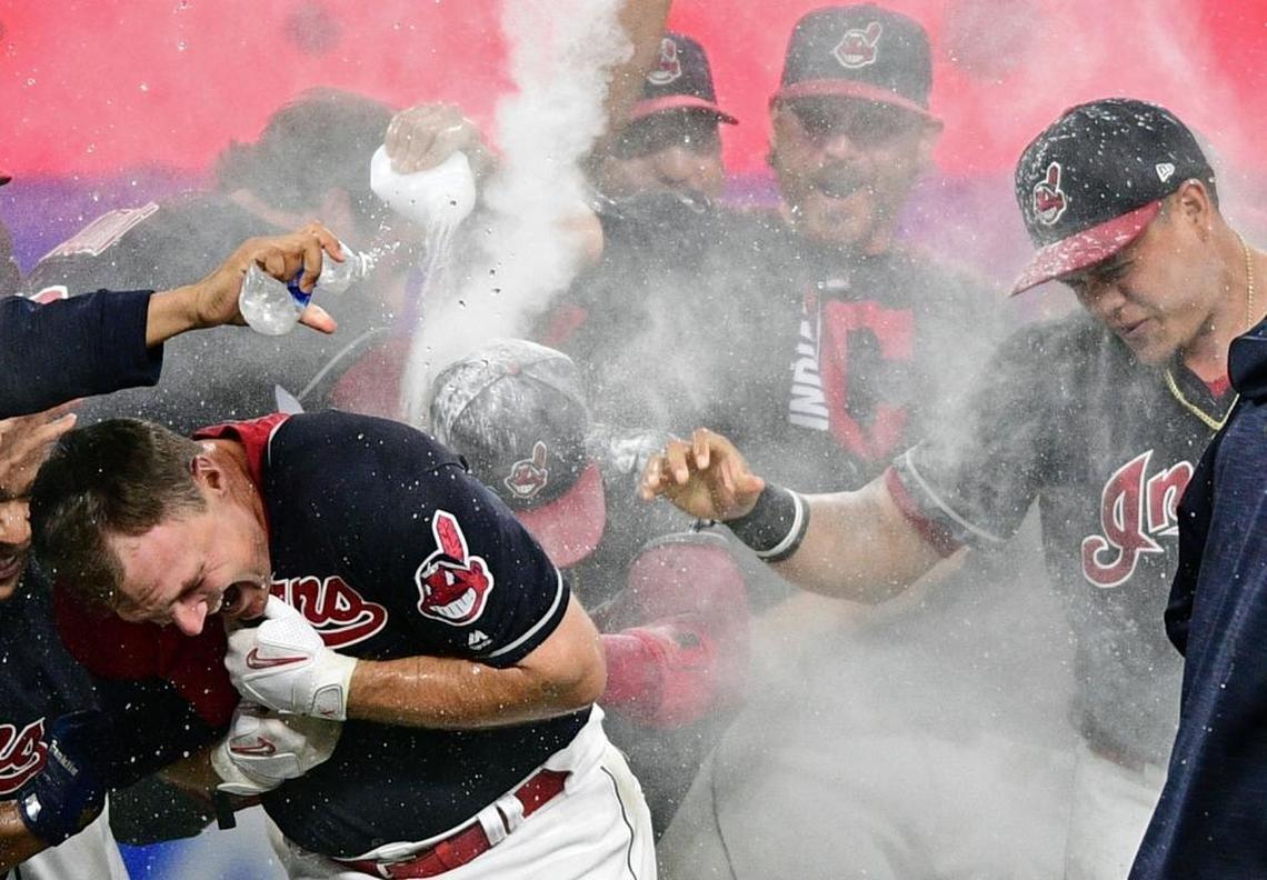 Cleveland Indians' Jay Bruce, left, celebrates with teammates after Bruce hit a double off Kansas City Royals pitcher Brandon Maurer to drive in the winning run during the 10th inning of a baseball game, Thursday, Sept. 14, 2017, in Cleveland. The Indians won 3-2.