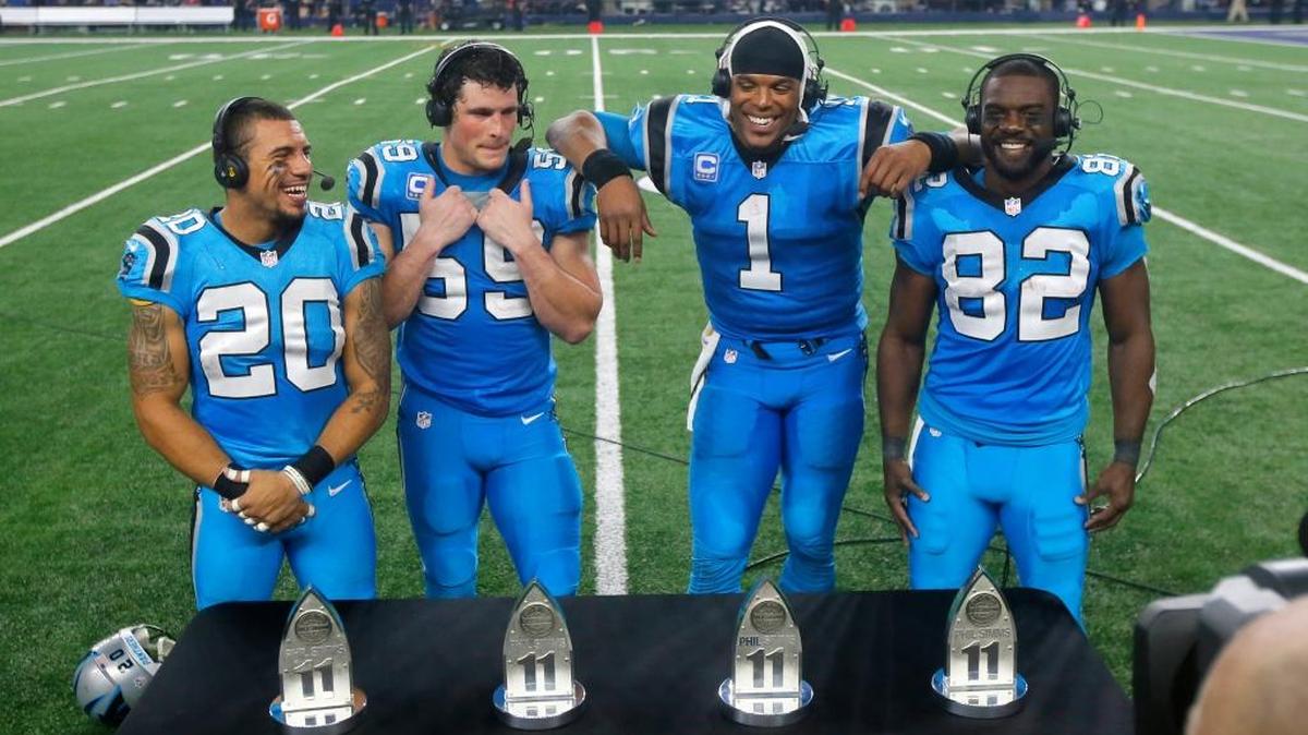 Carolina Panthers’ Kurt Coleman (20), Luke Kuechly (59), Cam Newton (1) and Jerricho Cotchery (82) particiate in a postgame interview after their 33-14 win over the Dallas Cowboys on Thursday, Nov. 26, 2015, in Arlington, Texas.