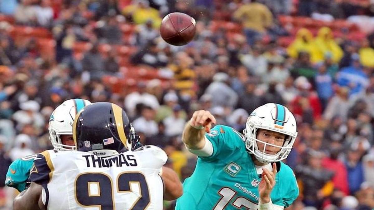 Miami Dolphins quarterback Ryan Tannehill throws a pass to Jarvis Landry, Landry caught the pass and was pushed into the endzone to score in the fourth quarter Los Angeles Rams at the Los Angeles Memorial Coliseum in Los Angeles, Calif. on Nov. 20, 2016.