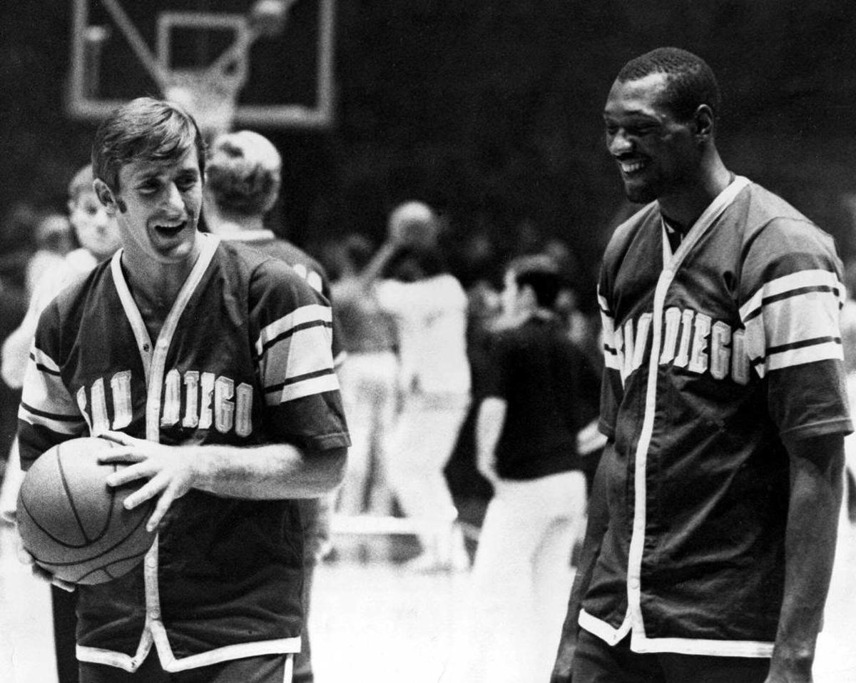 In this Nov. 19, 1968, file photo, Pat Riley, left, and Elvin Hayes of the San Diego Rockets exchange a few words before a game against the New York Knicks at New York's Madison Square Garden. Riley often was forced to wonder if his time in the NBA was over. Like when he got pulled out of a drill in his first training camp with San Diego and was told he had to get better.