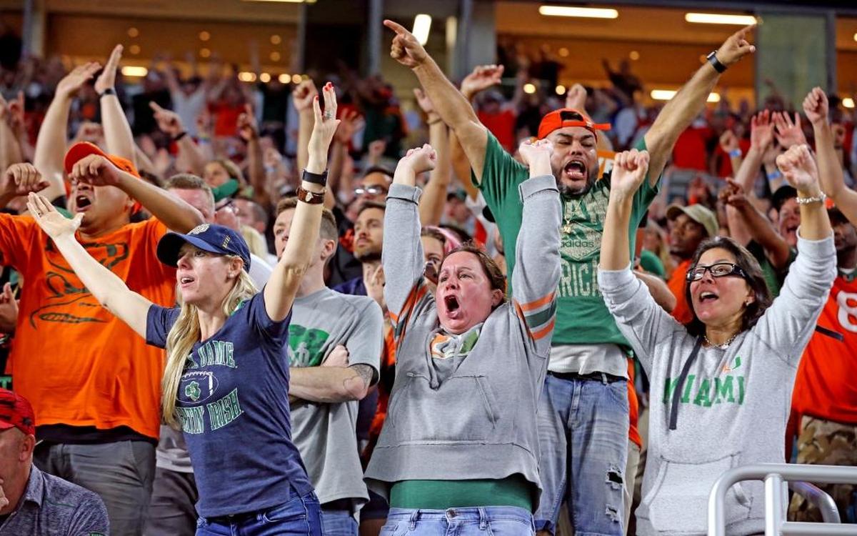 Miami Hurricanes fans scream as the Canes intercept the ball in the fourth quarter as they play Notre Dame at Hard Rock Stadium in Miami Gardens, Florida, Nov. 11, 2017.
