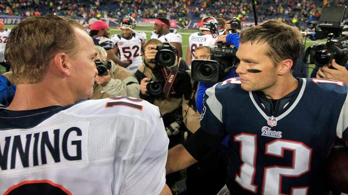 
FILE - In this Oct. 7, 2012, file photo, Denver Broncos quarterback Peyton Manning, left, and New England Patriots quarterback Tom Brady, right, speak in the middle of the field after the Patriots beat the Broncos 31-21 in an NFL football game in Foxborough, Mass.
