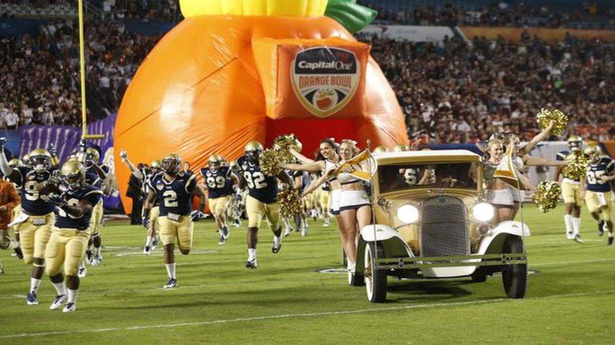 
Georgia Tech runs out onto the field for the start of the game. Mississippi State vs Georgia Tech at the 2014 Orange Bowl Game at Sun Life Stadium on Wednesday, December 31, 2014.
