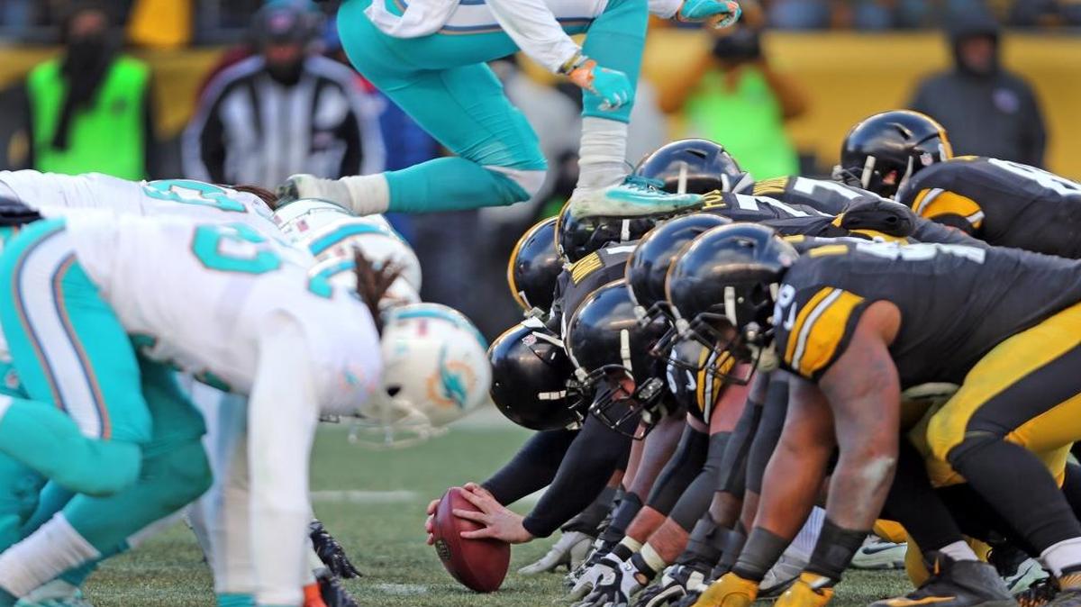 Miami Dolphins Tony Lippet leaps over the front lines of the Fins and Pittsburgh Steelers in an attempt to block a field goal in the NFL Wild-Card Playoffs at Heinz Stadium, Pittsburgh, PA, January 8, 2017. The leap resulted in a penalty.