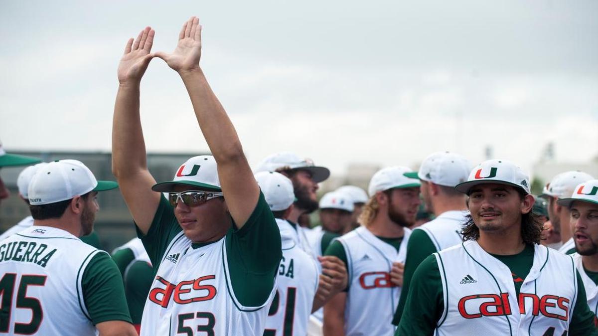 Miami Hurricanes pitcher Andrew Cabezas (53) holds up the U after winning their game against Boston College in game 3 of the NCAA Super Regionals held at Mark Light Field on June 12, 2016.