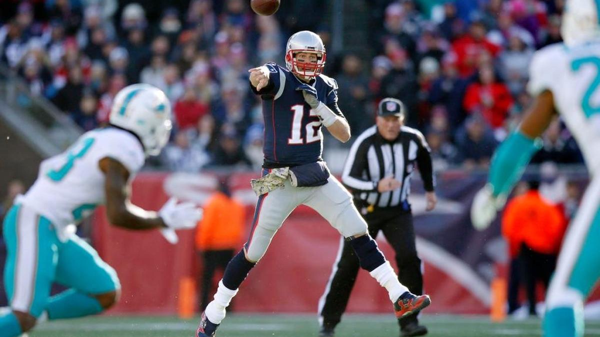 Patriots quarterback Tom Brady, shown beating the Dolphins Sunday in Foxborough, is handling the rest of the NFL just as easily in Miami Herald’s NFL QB rankings.
