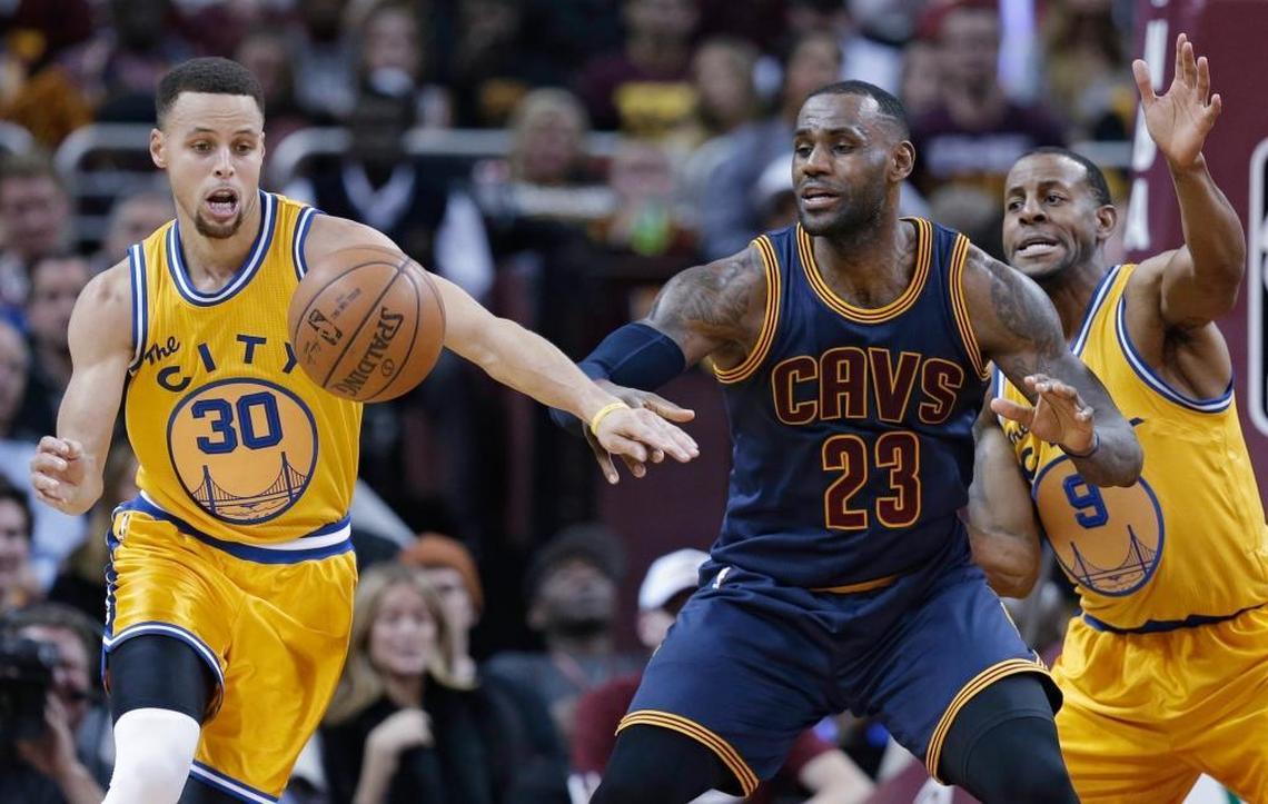 In this Jan. 18, 2016, filephoto, Golden State Warriors Stephen Curry (30) knocks the ball loose from Cleveland Cavaliers' LeBron James (23) duriing the first half of an NBA basketball game in Cleveland.