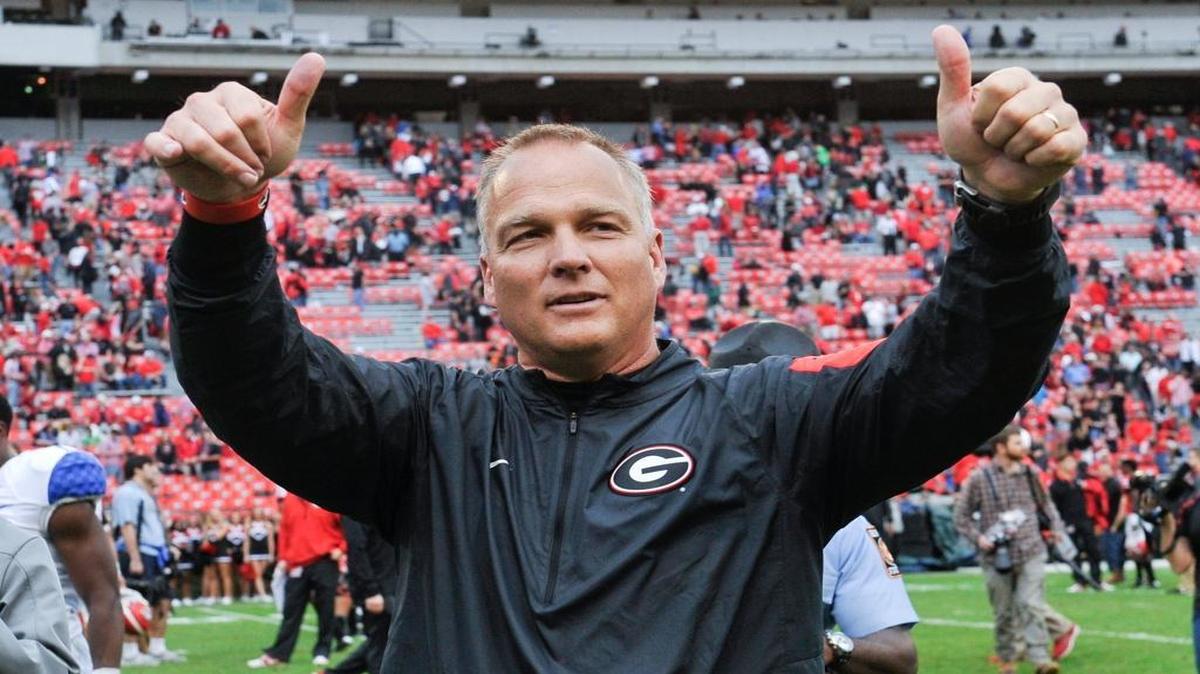 Former Georgia head coach Mark Richt gives a thumbs up to the crowd as he walks off the field after an NCAA college football game against Kentucky, Saturday, Nov. 7, 2015, in Athens, Ga.