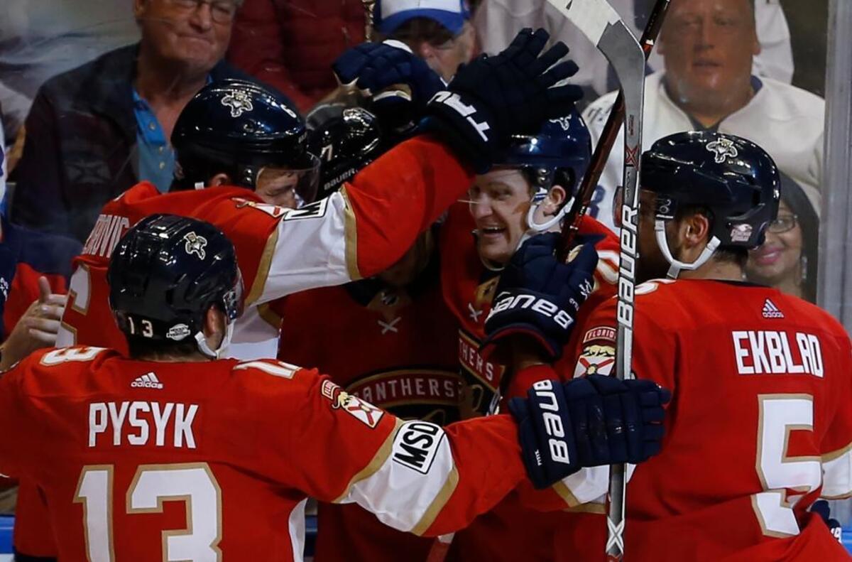 Florida Panthers center Jared McCann, second from right, celebrates with teammates after his game-winning overtime goal against the Toronto Maple Leafs on Tuesday, Feb. 27, 2018, in Sunrise. Florida won 3-2.