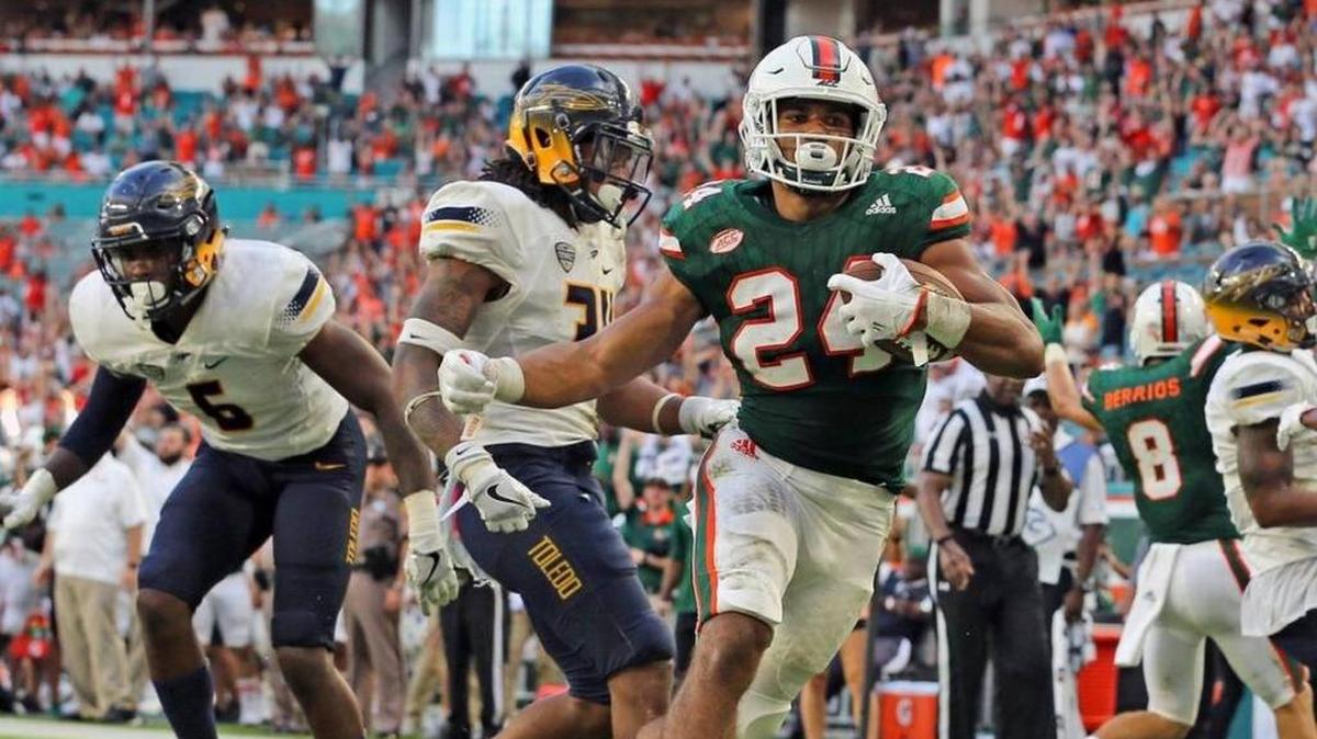 Canes running back Travis Homer, shown in action vs. Toledo earlier this season, keeps climbing in Herald’s State Offensive Player of the Year rankings.