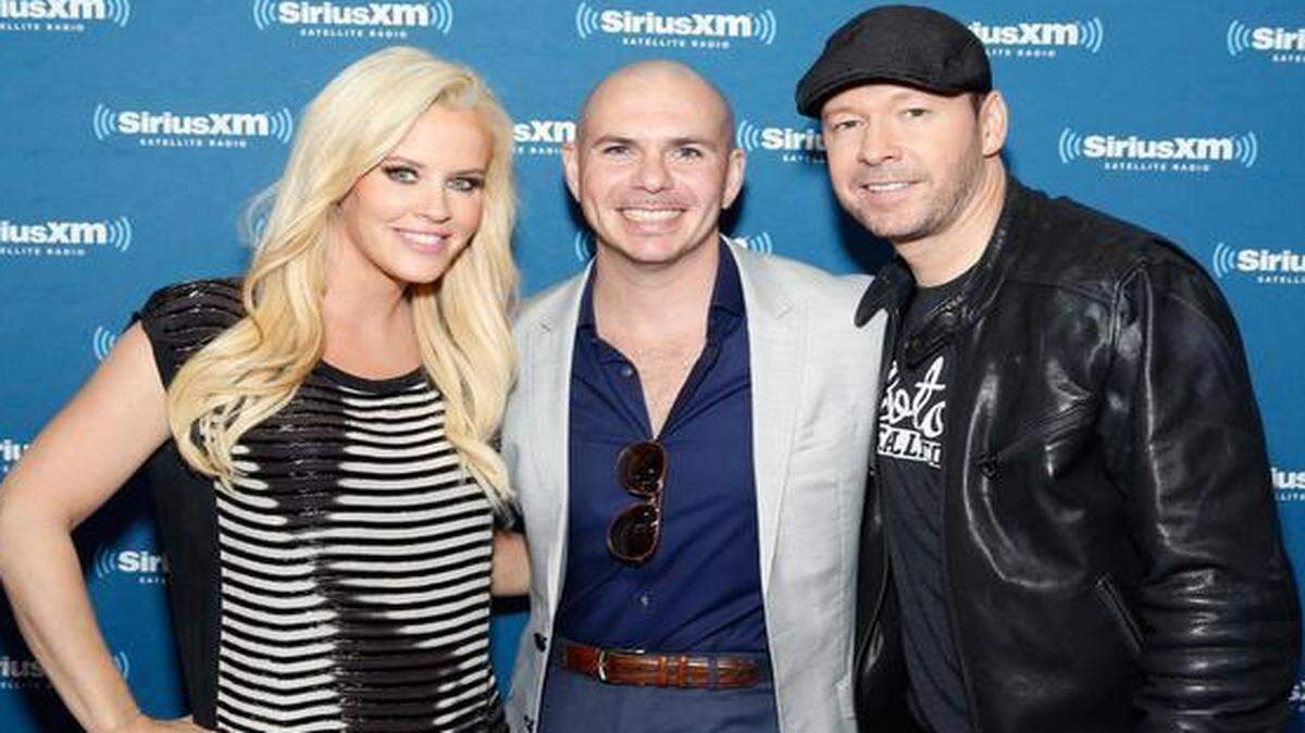 
TV personality Jenny McCarthy, recording artist Pitbull and singer/actor Donnie Wahlberg attend SiriusXM at Super Bowl XLIX Radio Row at the Phoenix Convention Center on January 30, 2015 in Phoenix, Arizona.
