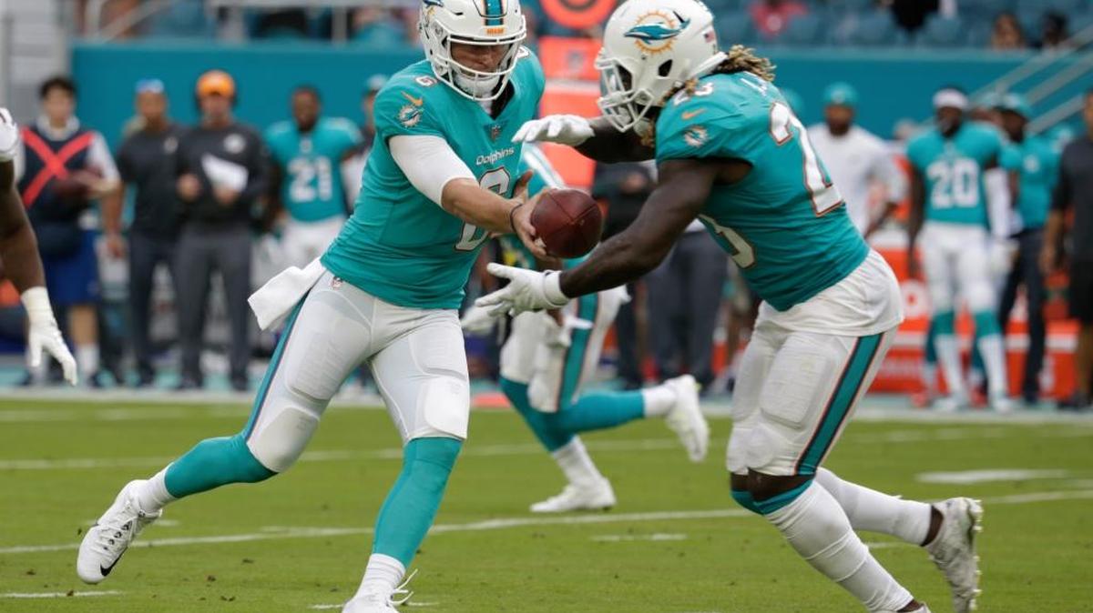 Miami Dolphins quarterback Jay Cutler (6) hands the ball to running back Jay Ajayi (23), during the first half of an NFL preseason football game against the Baltimore Ravens on Aug. 17, 2017.