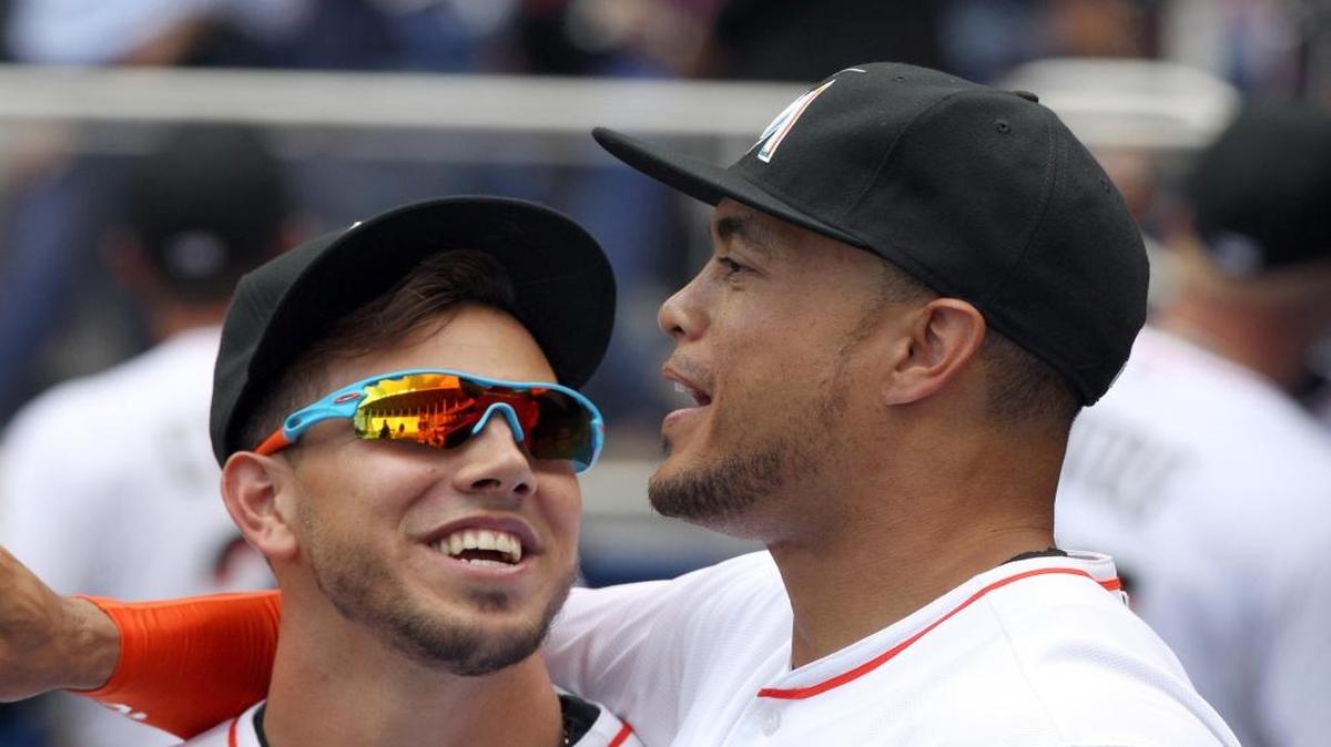 Miami Marlins pitcher Jose Fernandez having fun with Miami Marlins right fielder Giancarlo Stanton just before starting the Opening Day game Miami Marlins vs Atlanta Braves at Marlins Park on Monday,April 6, 2015.