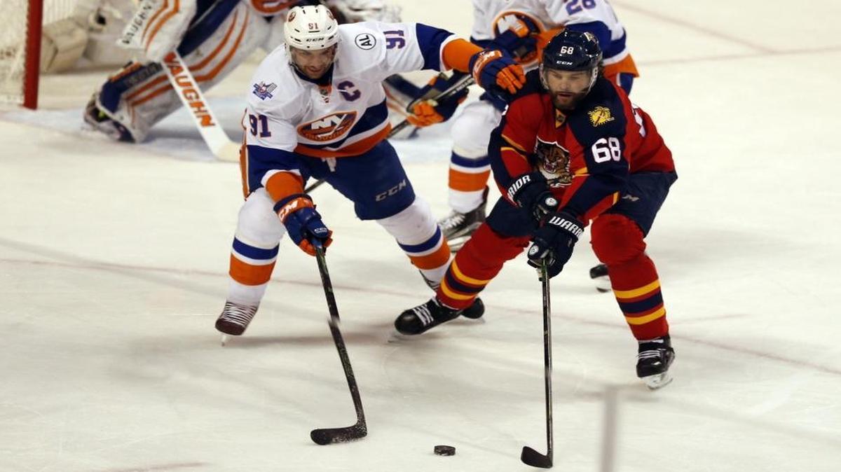 Florida Panthers right wing Jaromir Jagr (68) goes up against New York Islanders center John Tavares (91) in the first period as the Panthers host the New York Islanders in Game 5 of the playoffs at the BB&T Center on Fri., April 22, 2016.