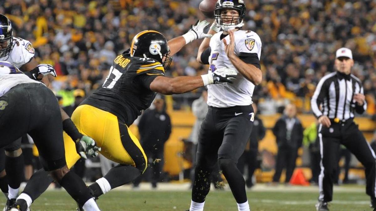 
Pittsburgh Steelers defensive end Cameron Heyward (97) hits Baltimore Ravens quarterback Joe Flacco (5) in the second quarter of an NFL wildcard playoff game Saturday, Jan. 3, 2015 in Pittsburgh. 
