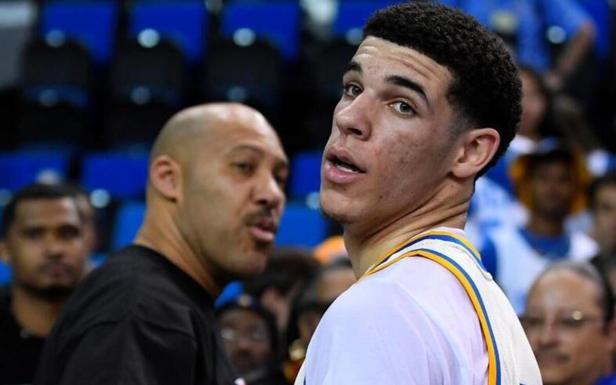 UCLA guard Lonzo Ball, right, walks away after hugging his father, LaVar, following the team's NCAA college basketball game against Washington State in Los Angeles. The UCLA freshman point guard has been one of college basketball's best players and could be the No. 1 pick in the NBA draft. He's kept up his high-level of play over the past month as his father, LaVar, has become more vocal in the media.