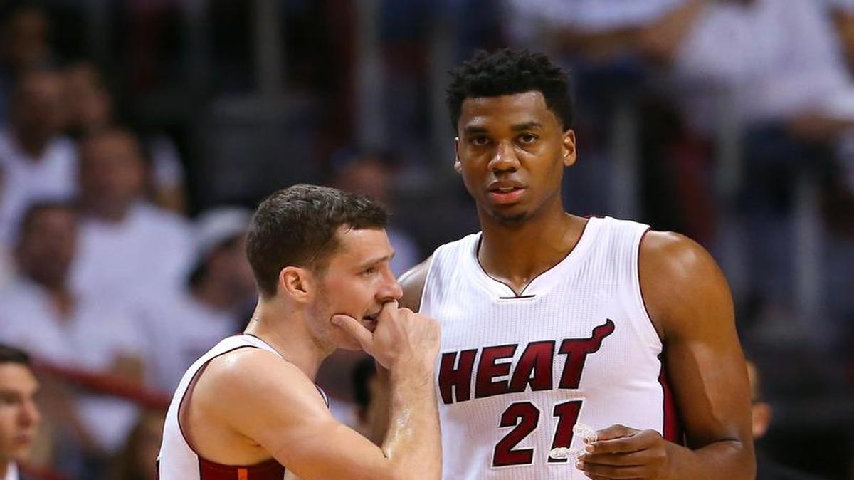 Miami Heat guard Goran Dragic talks with Hassan Whiteside during the second quarter of Game 7 of the first round of the 2016 NBA Eastern Conference Playoffs against the Charlotte Hornets at AmericanAirlines Arena in Miami on Sunday, May 1, 2016.