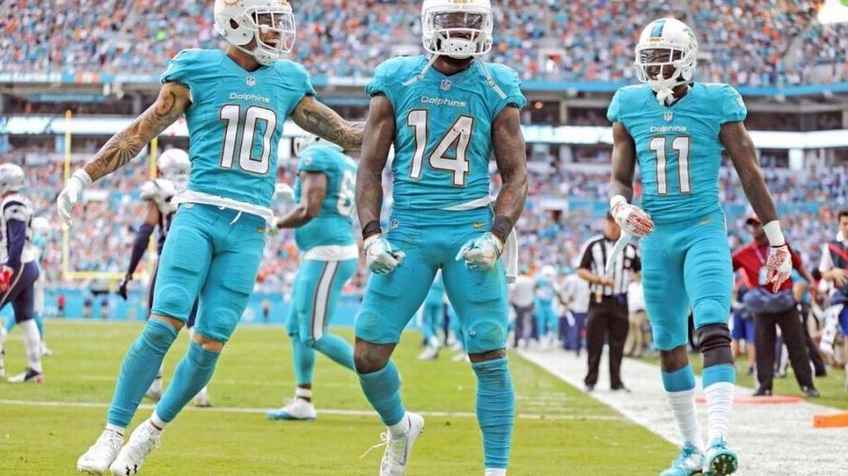 Dolphins Kenny Stills, Jarvis Landry and DeVante Parker celebrating a touchdown.