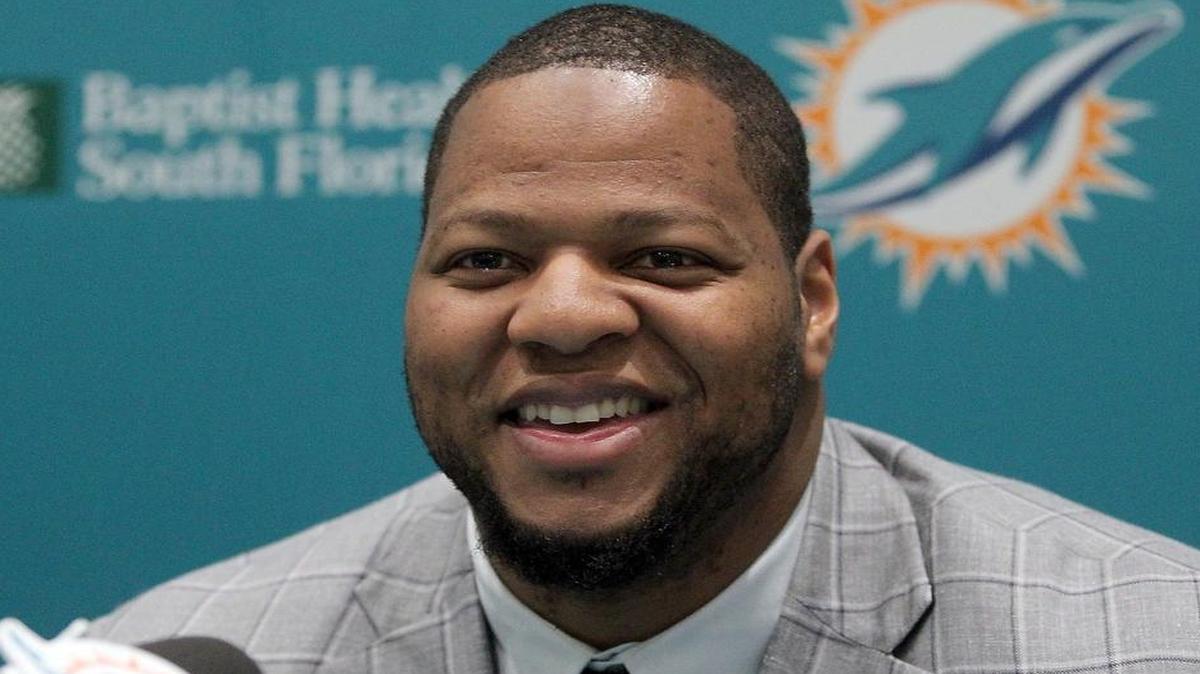 
Miami Dolphins defensive tackle Ndamukong Suh is all smiles at his introductory press conference Wednesday, March 11, 2015.
