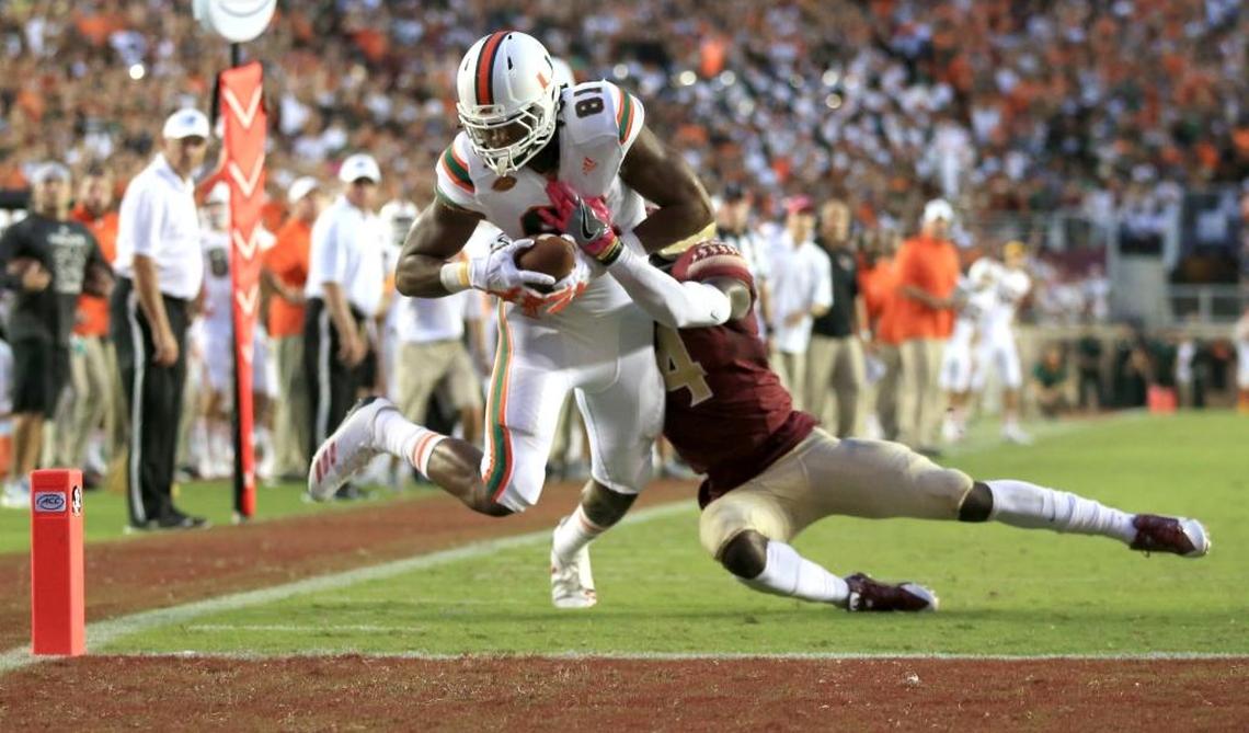 Miami Hurricanes wide receiver Darrell Langham (81) scores the final touchdown in the fourth quarter as Florida State Seminoles defensive back Tarvarus McFadden (4) fails to defend as the Seminoles host the Miami Hurricanes at Doak Campbell Stadium in Tallahassee on Saturday, Oct. 7, 2017.