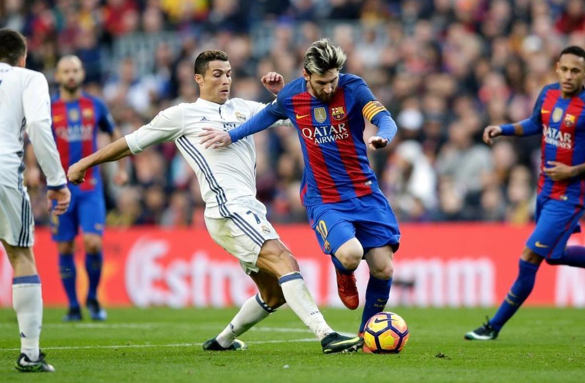 Barcelona's Lionel Messi, center right, and Real Madrid's Cristiano Ronaldo will clash July 29 at the Hard Rock Stadium in ‘El Clasico’.