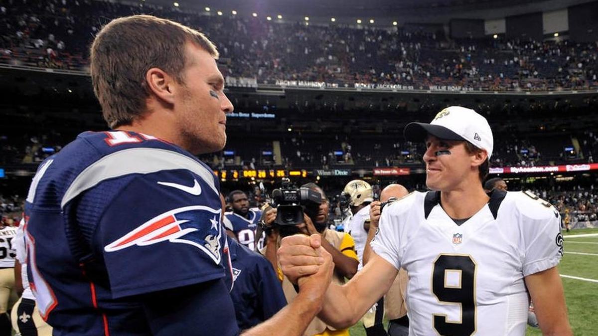 The Saints’ Drew Brees (9), shown greeting the Patriots’ Tom Brady after a 2017 meeting. Sunday, all-time greats Brees and Brady, now with Tampa Bay, meet for only the seventh time.