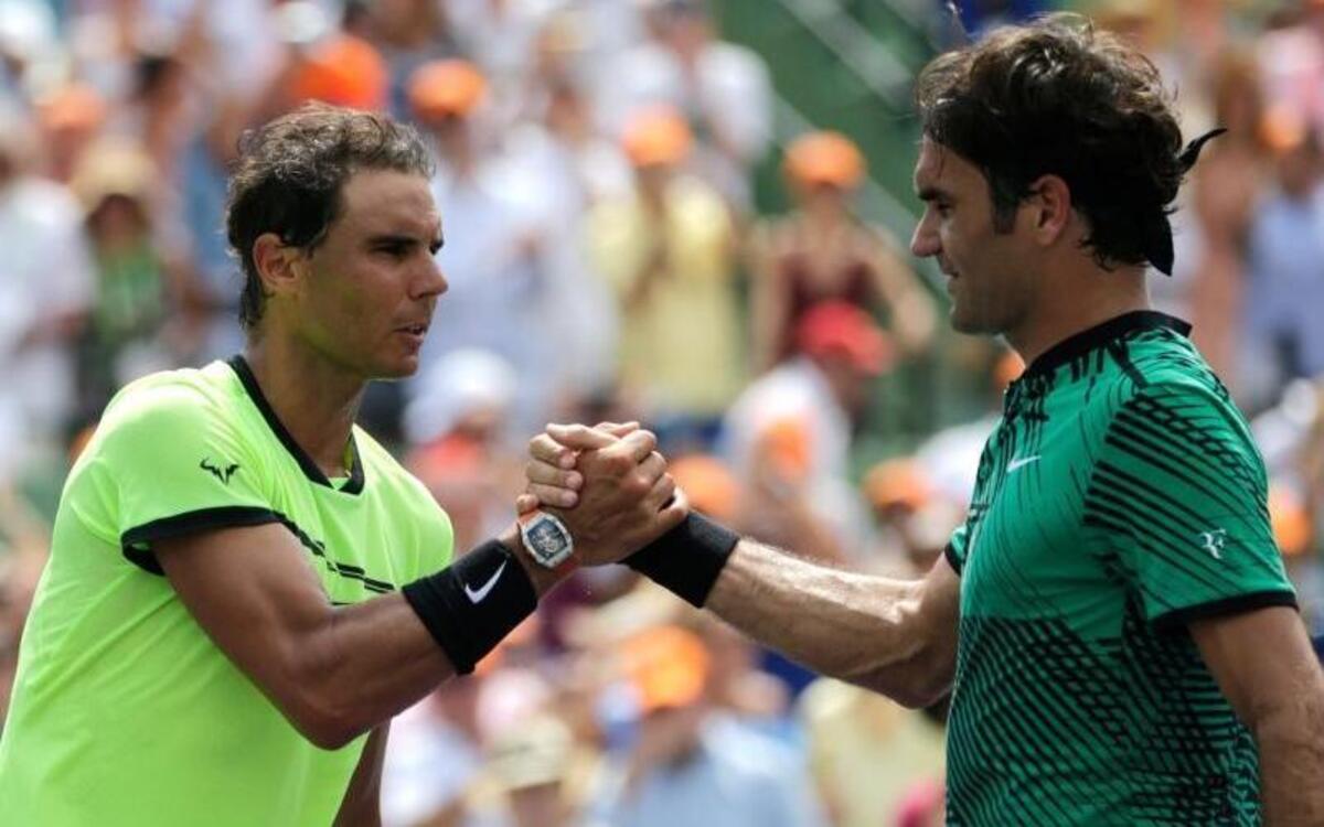 Rafael Nadal, of Spain, shakes hands with Roger Federer, of Switzerland, after the men's singles final at the Miami Open tennis tournament, Sunday, April 2, 2017, in Key Biscayne, Fla. Federer won 6-3, 6-4.