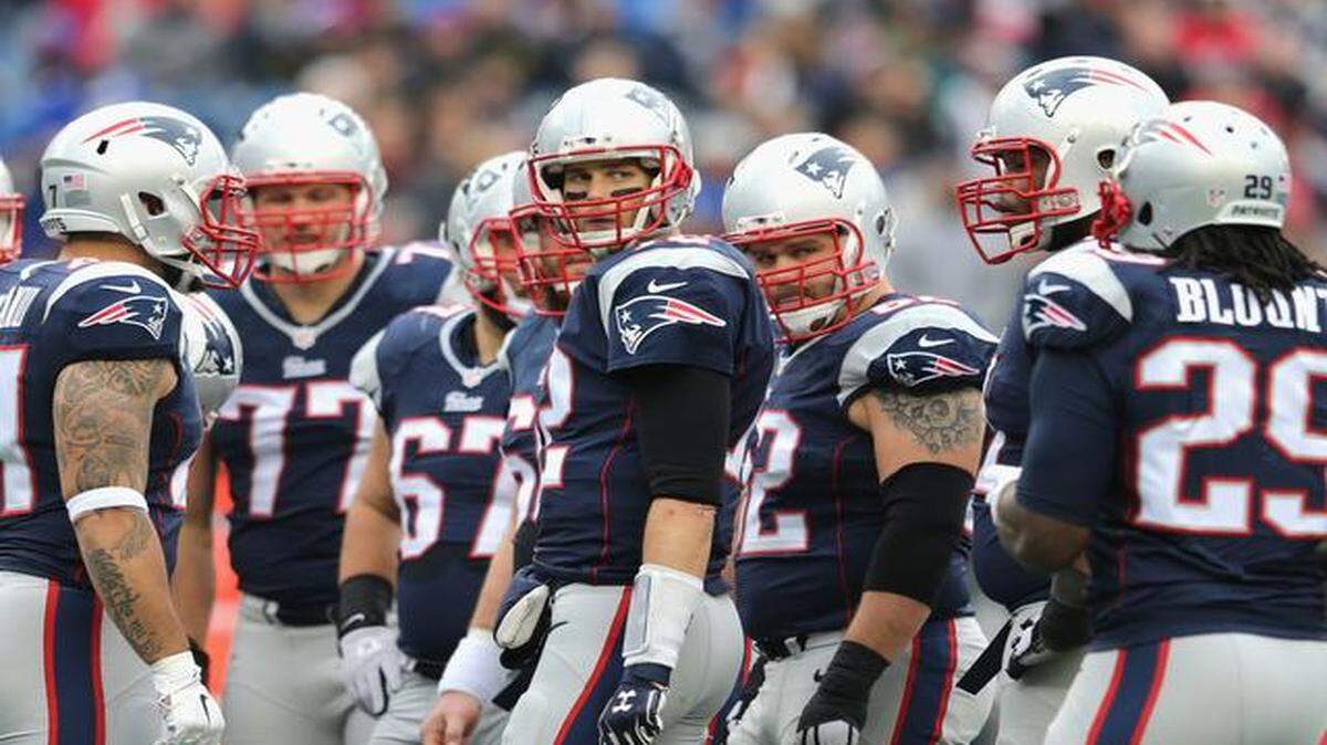 
Tom Brady (12) of the New England Patriots reacts in the huddle during the second quarter against the Buffalo Bills at Gillette Stadium on Dec. 28, 2014, in Foxboro, Massachusetts.
