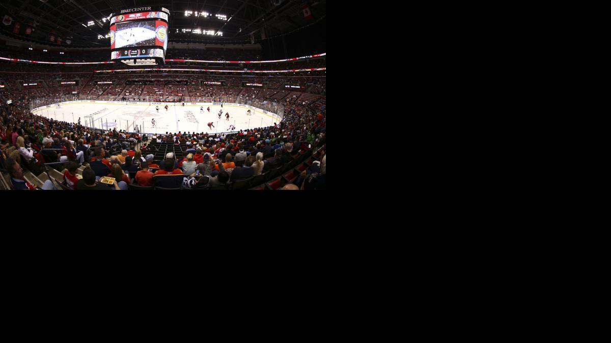 
In this image made with a fisheye lens, Florida Panthers hockey fans watch game action against the New Jersey Devils during the first period of a NHL hockey game in Sunrise on Oct. 11, 2014.
