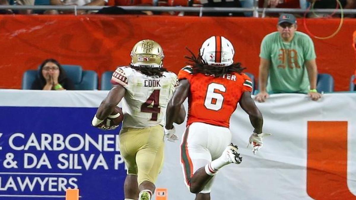Florida State Seminoles running back Dalvin Cook runs after catches a pass for a touchdown in the third quarter of an NCAA college football game against University of Miami Hurricanesat Hard Rock Stadium on Saturday October 8, 2016, in Miami Gardens.