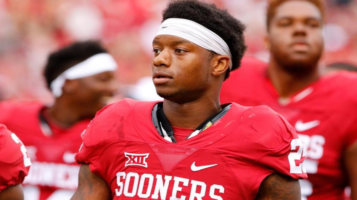 Oklahoma running back Joe Mixon (25) before the start of an NCAA college football game against Tulsa in Norman, Okla. In a video released by the Norman Police Department, Amelia Molitor said a group of men with Mixon sexually harassed her and she rejected Mixon's advances before Mixon punched her and broke bones in her face in July 2014.