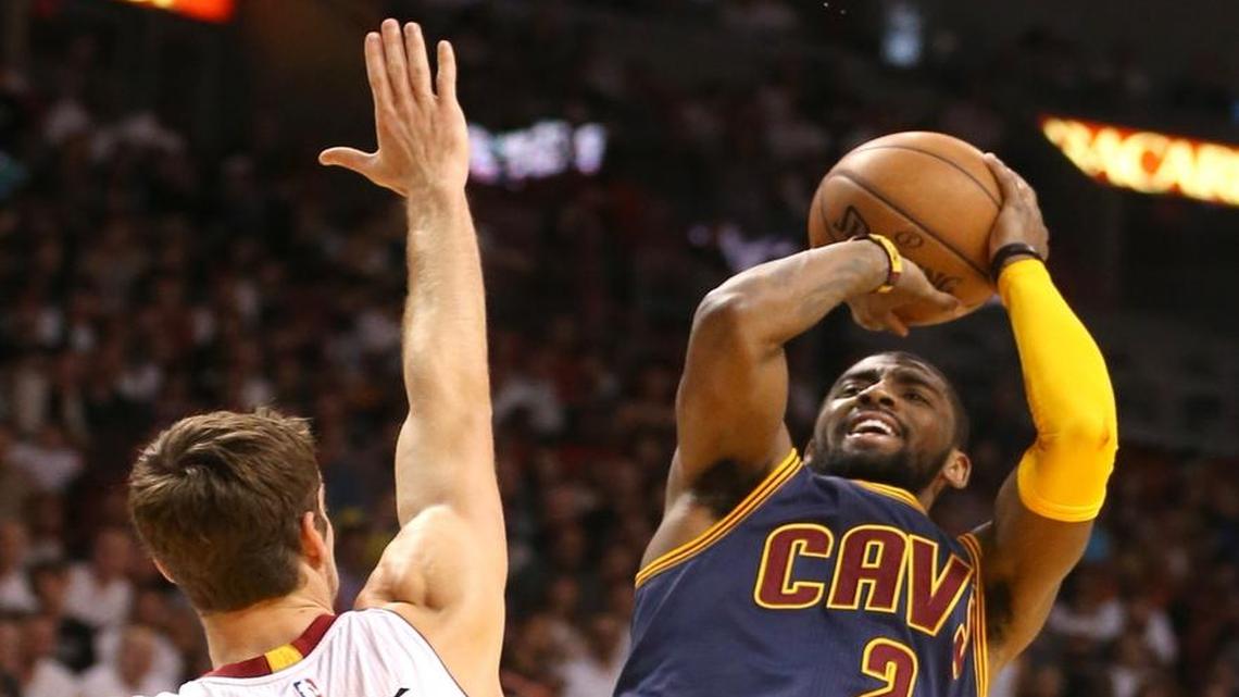 Miami Heat Goran Dragic defends Cleveland Cavaliers Kyrie Irving in the first quarter at the AmericanAirlines Arena in Miami on March 16, 2015.