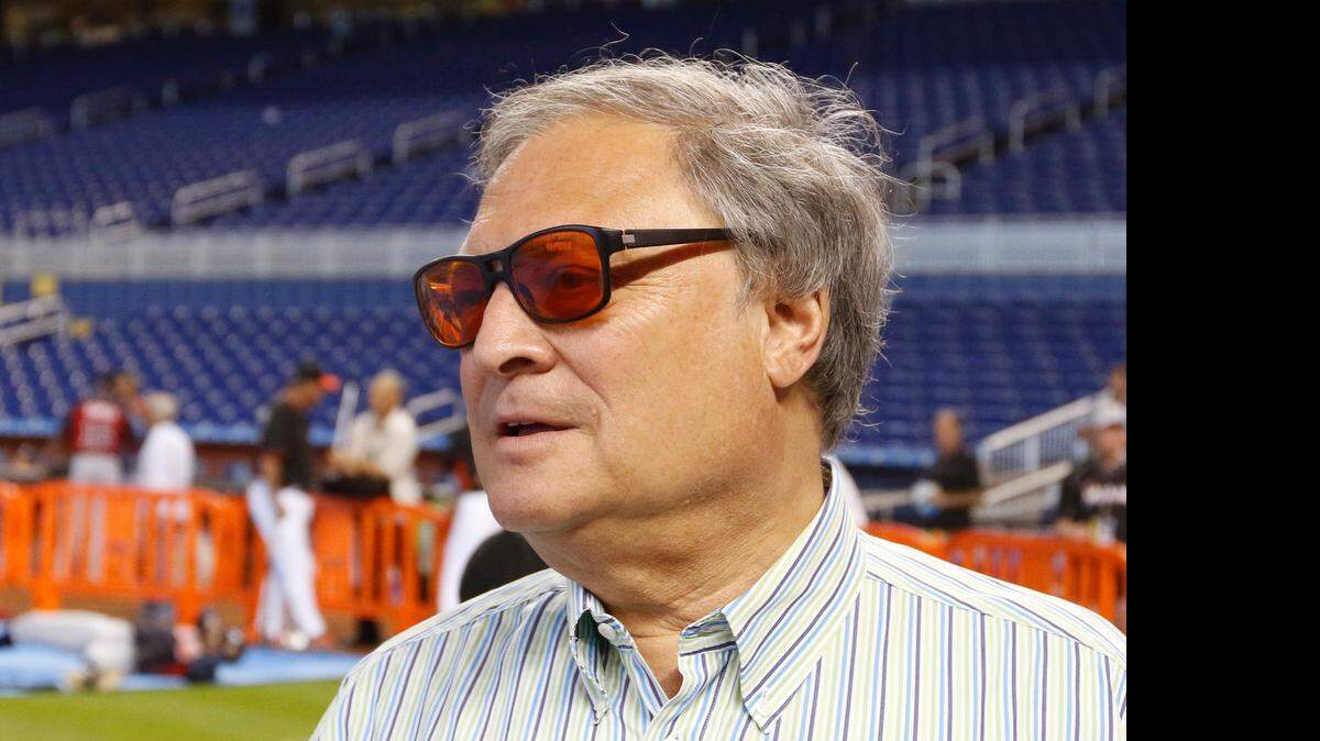 
Miami Marlins owner Jeffrey Loria speaks with reporters before the Marlins met the Atlanta Braves in their baseball game in Miami, Tuesday, April 7, 2015. 

