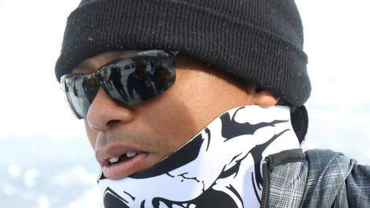 
Tiger Woods walks in the finish area of an alpine ski, women's World Cup super-G, in Cortina d'Ampezzo, Italy, Monday, Jan. 19, 2015.

