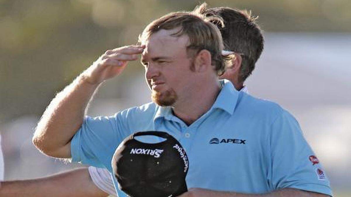 
J.B. Holmes reacts after finishing his round of 10-under-par 62 at the WGC-Cadillac Championship at Trump National Doral on Thursday, March 5, 2015. 
