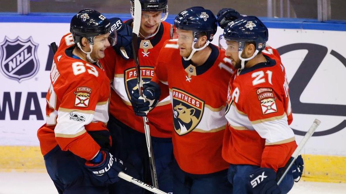 Teammates congratulate Florida Panthers center Jonathan Huberdeau, second from right, after he scored a goal during the second period of an NHL preseason hockey game against the Tampa Bay Lightning on Sept. 26. Others from left, right wing Evgeni Dadonov, center Aleksander Barkov and center Vincent Trocheck.