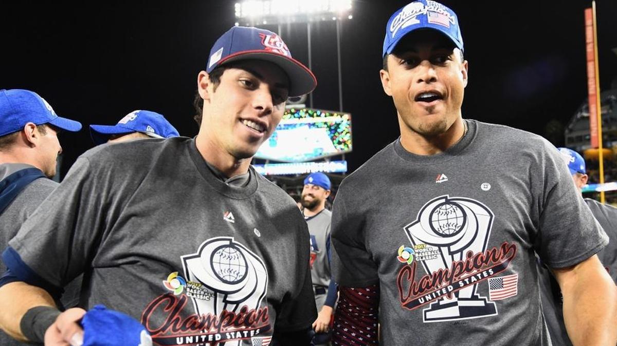 Christian Yelich, left, and Giancarlo Stanton of team United States celebrate their 8-0 win against Puerto Rico on March 22. With baseball’s winter meetings approaching, Stanton is like one of his home runs: Going, going ... gone!