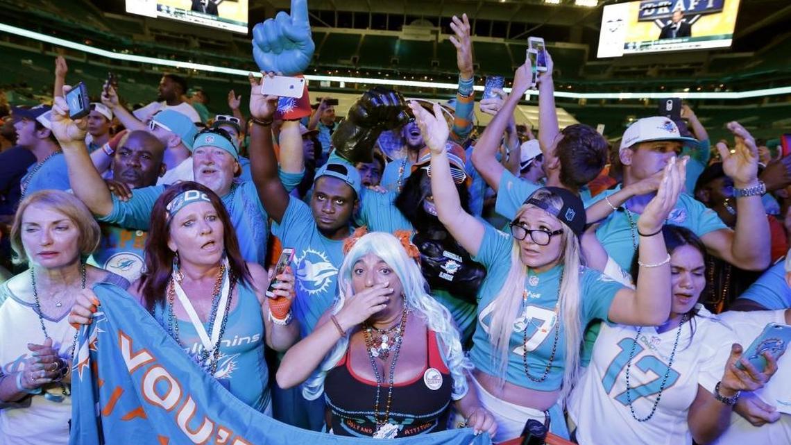 Dolphin fans react after the team selects Charles Harris of Missouri during the Dolphins 2017 NFL Draft Party at Hard Rock Stadium on Thurs., April 27, 2017.