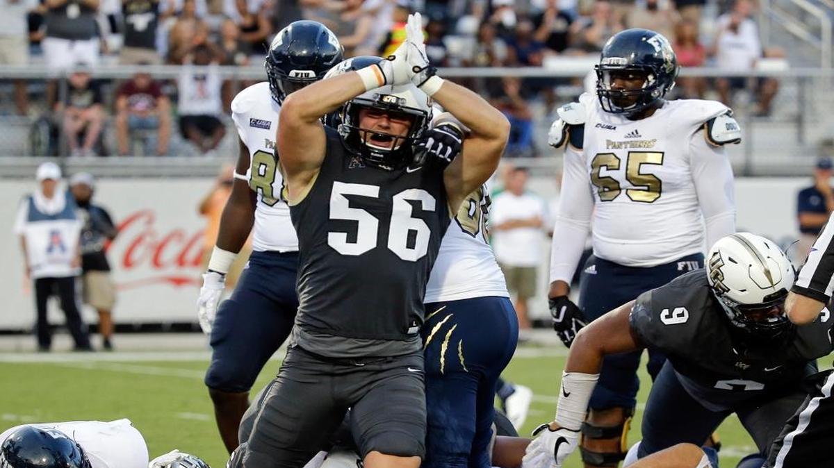 Central Florida linebacker Pat Jasinski (56) signals a safety against Florida International after running back Alex Gardner was stopped in the end zone by the Central Florida defense during the first half of an NCAA college football game, Thurs., Aug. 31, 2017, in Orlando, Fla.