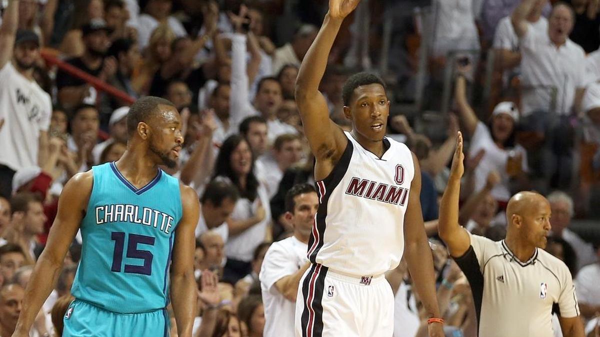 Josh Richardson celebrates his three-pointer as reacts in the third quarter of Game 2 between the Miami Heat and Charlotte Hornets at AmericanAirlines Arena in Miami on Wednesday, April 20, 2016.