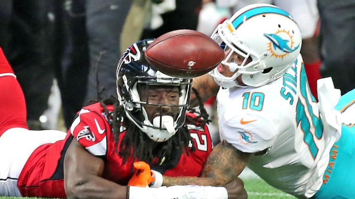 Miami Dolphins Kenny Stills (10) battles for a pass with Atlanta Falcons Desmond Trufant (21) in the second quarter at the Mercedes-Benz Stadium in Atlanta, Georgia, Oct. 15, 2017.