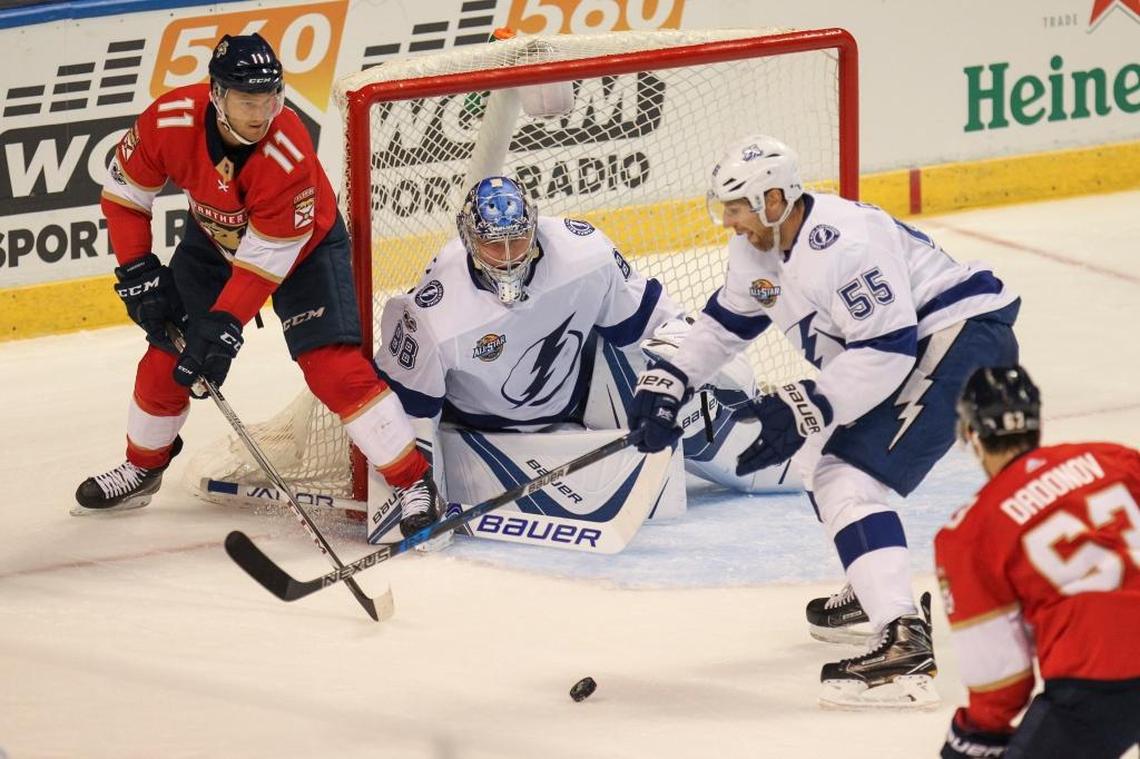 Florida Panthers left wing Jonathan Huberdeau (11) tries to score while Tampa Bay Lightning defenseman Braydon Coburn (55) defends during the first period of an NHL hockey game at the BB&T Center on Saturday, Oct. 7, 2017 in Sunrise.